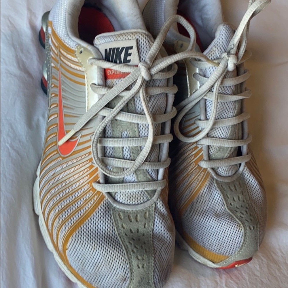 Grey and orange Nike Shock sneakers